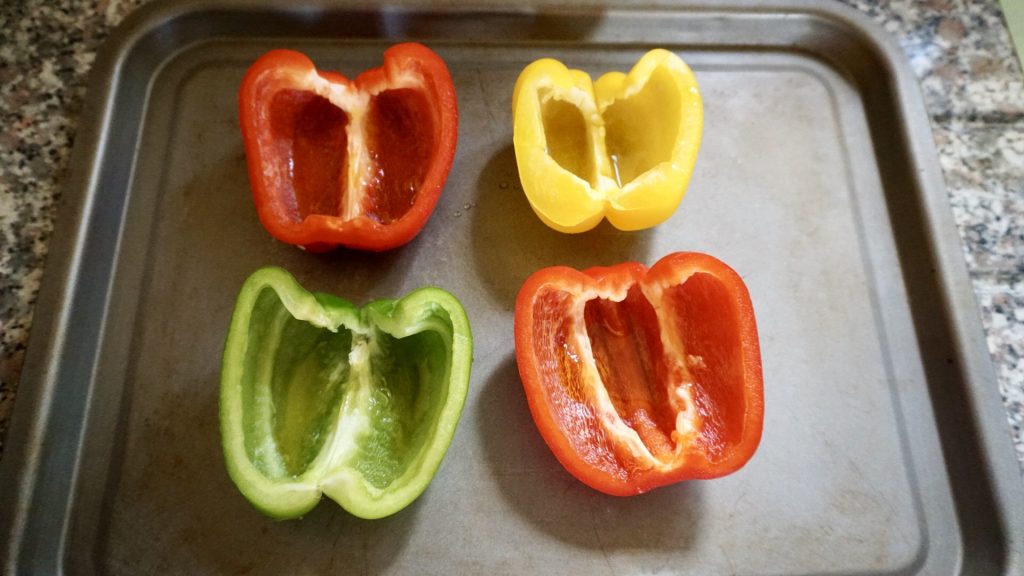 Preparing stuffed peppers with rice and cashew nuts