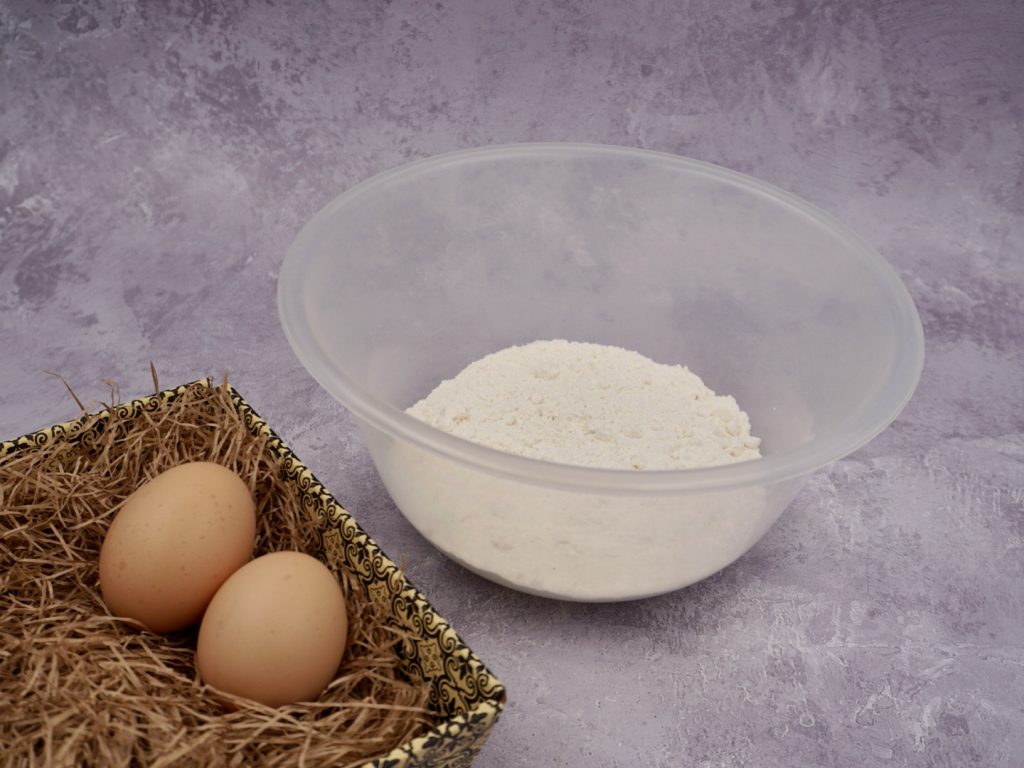 Flour and eggs ready to make egg pasta