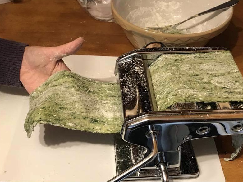 Rolling out pasta verde