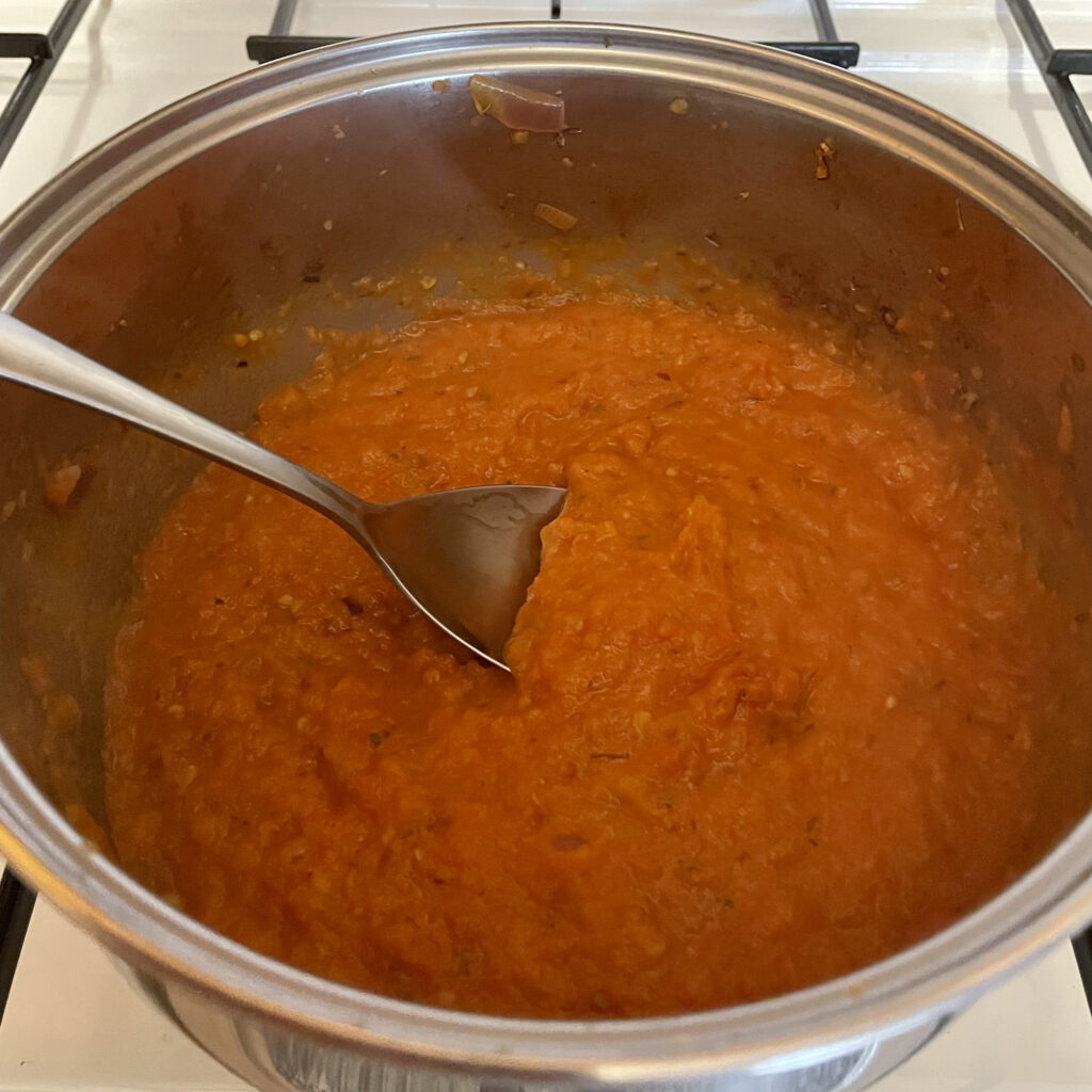 Making fresh tomato sauce for pasta