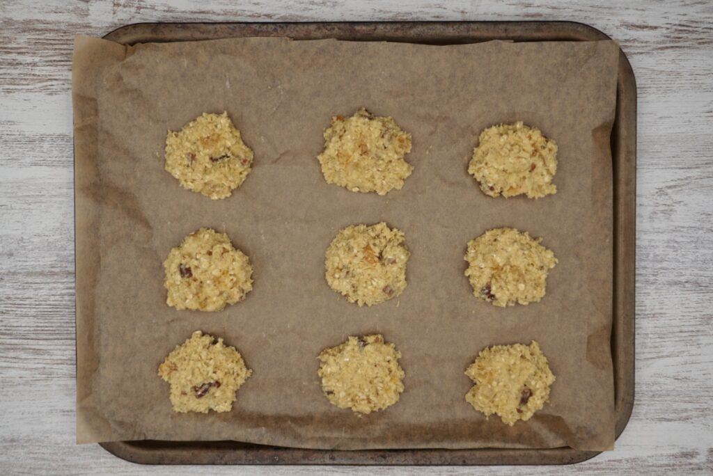 Unbaked pecan an apricot cookies on a tray