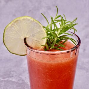 Watermelon and ginger cooler in a glass with garnish