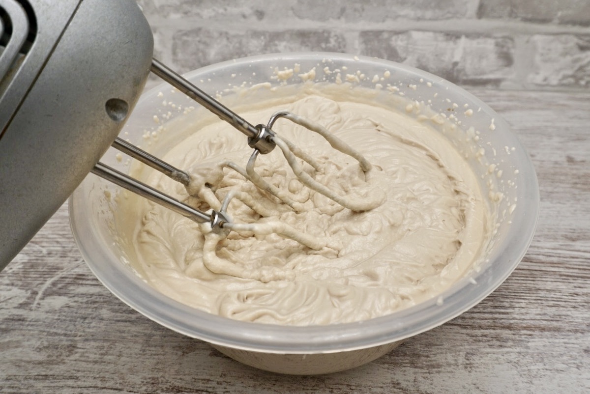 Cream and condensed milk being whisked