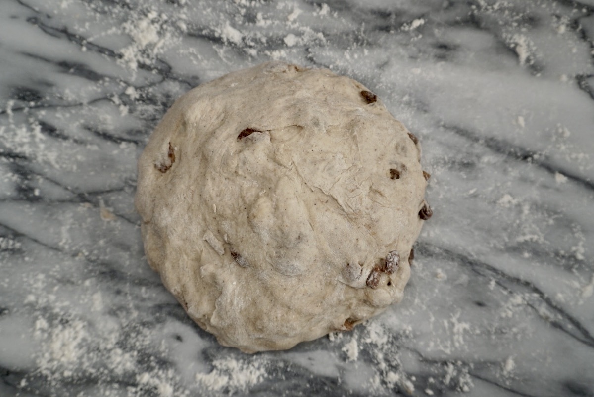 Dough for fruit bread on a floured pastry board