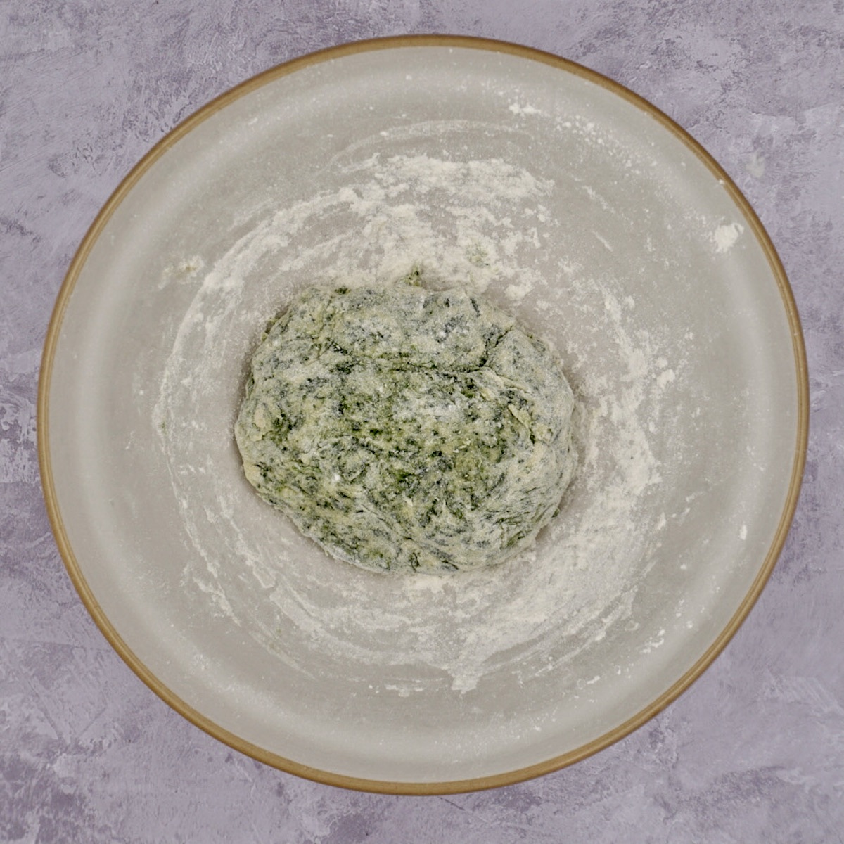 Spinach pasta dough in a bowl