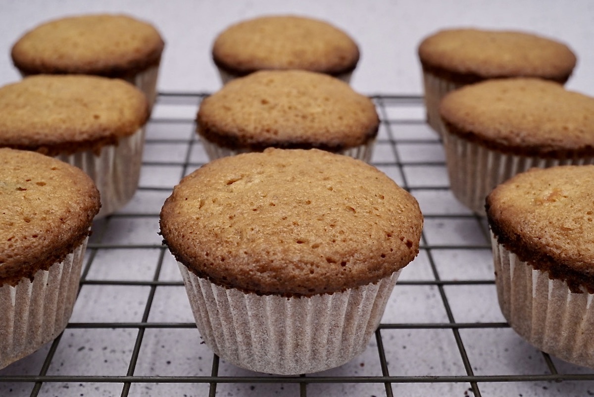 Undecorated carrot cake muffins on a rack