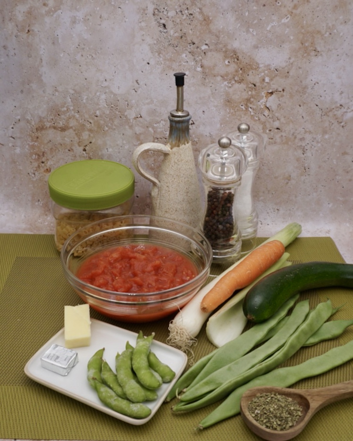 A collection of vegetables and ingredients for soup