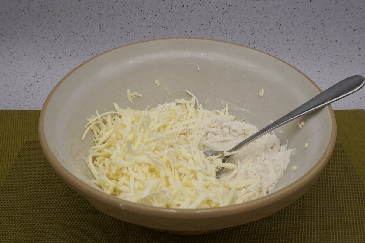 A bowl of flour and grated butter