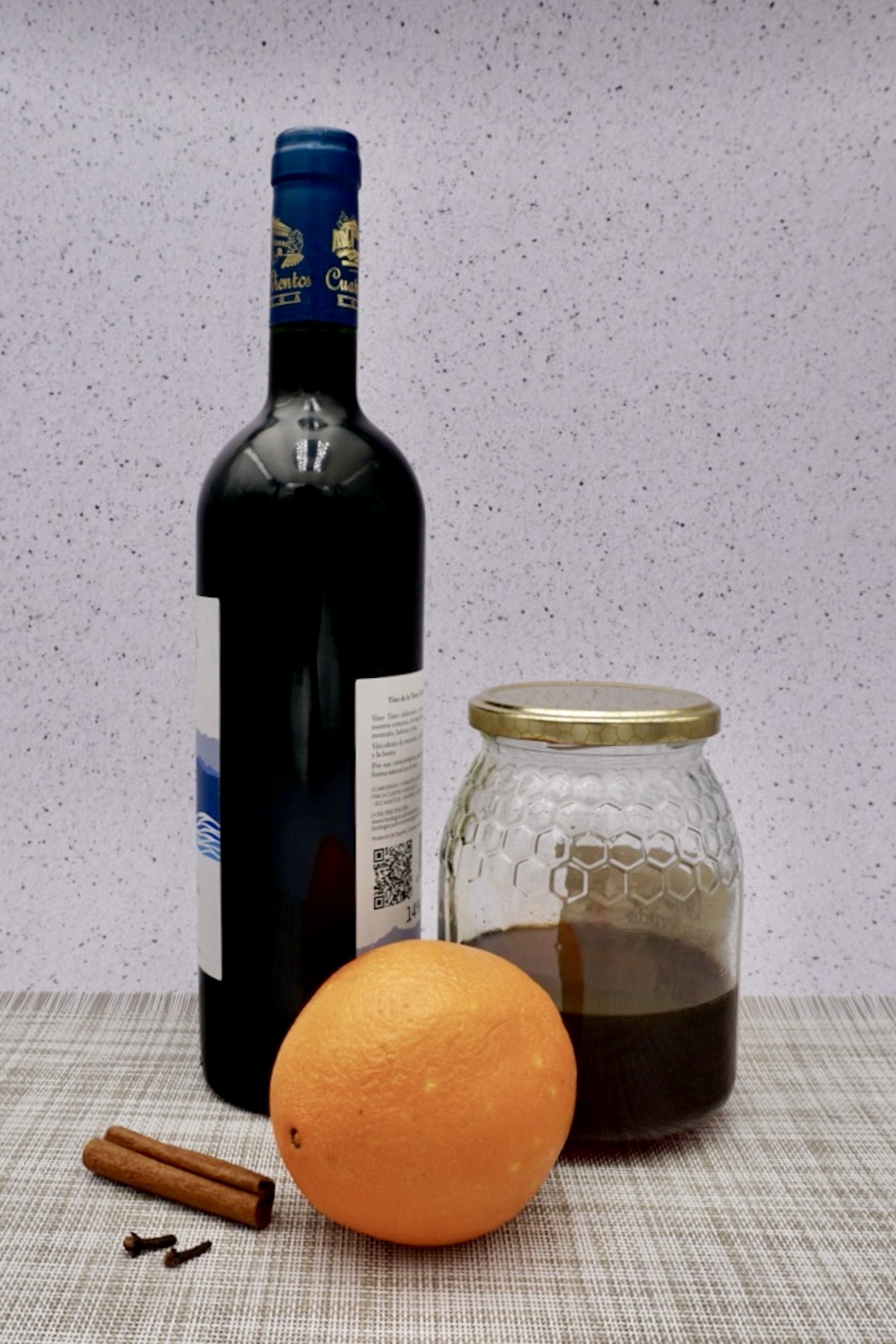 Wine, honey, an orange and spices