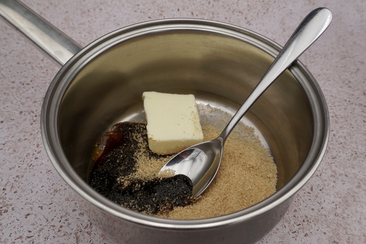 Butter, honey and Demerara in a pan with a spoon