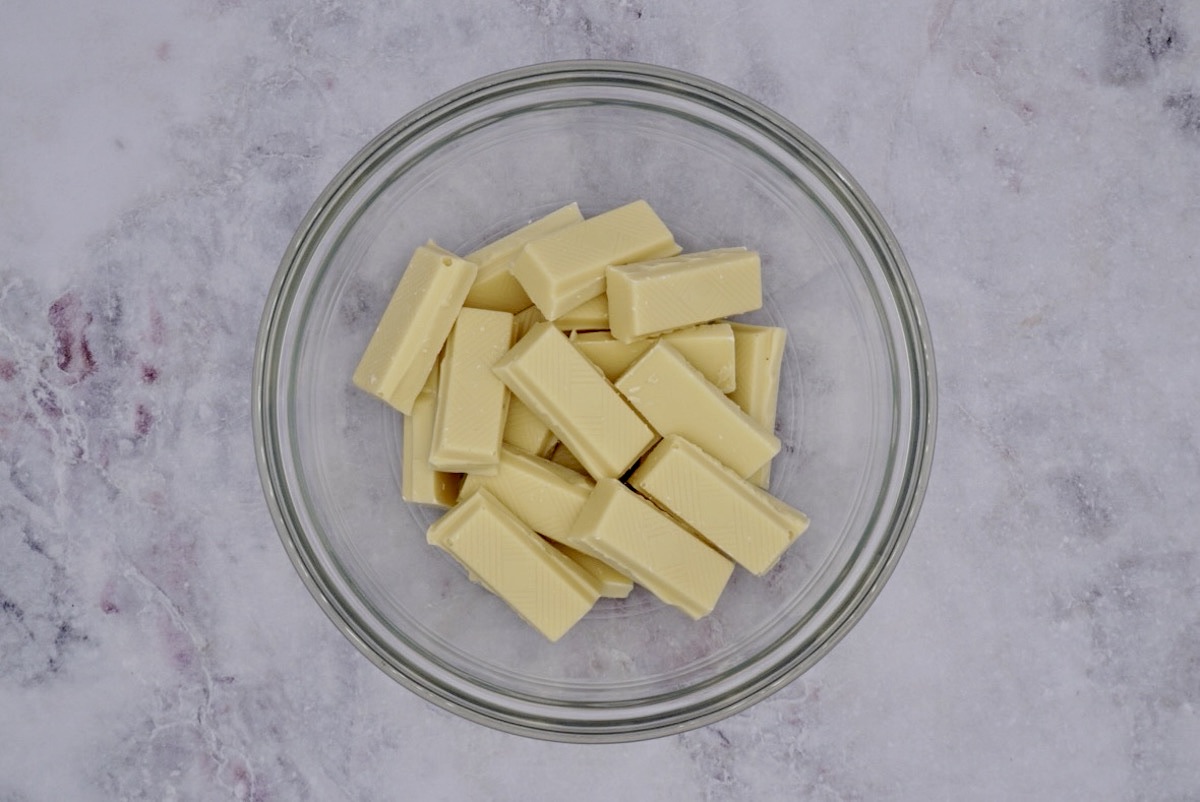 Pieces of white chocolate in a glass bowl