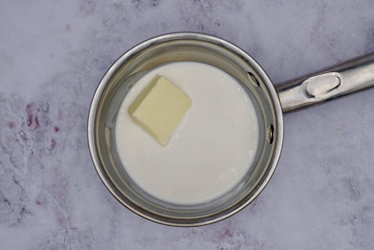 A pan with cream and a block of butter