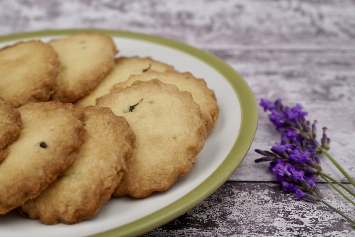 A plate of lavender shortbread and lavender flowers