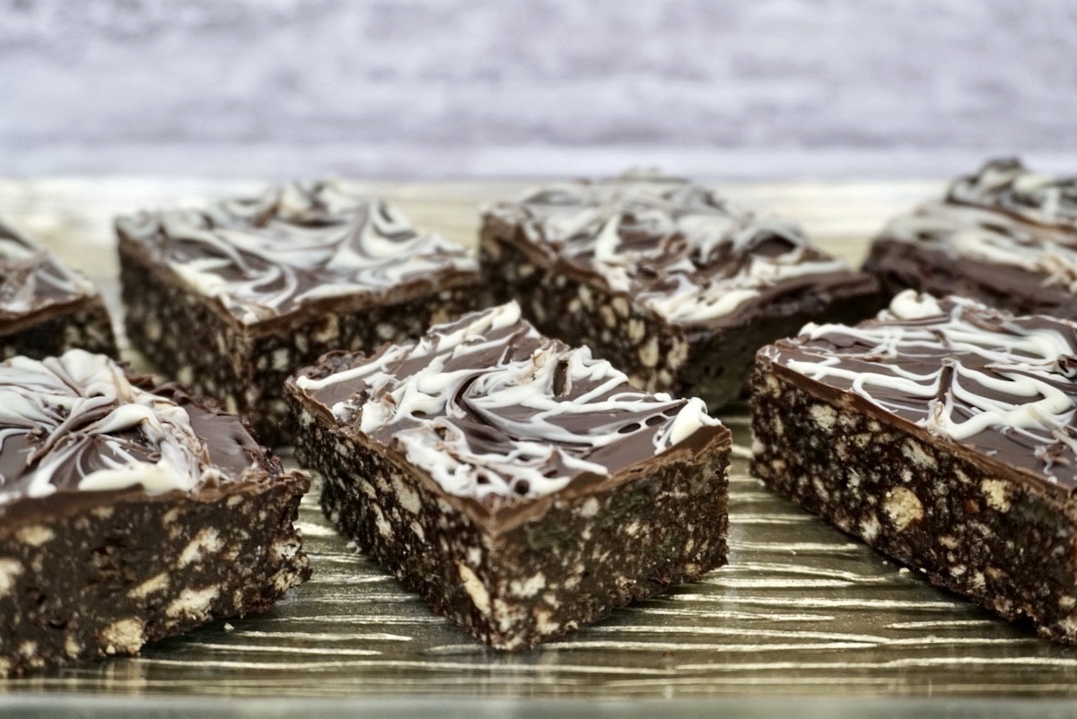 Squares of chocolate tiffin on a plate