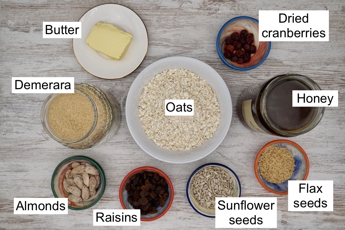 Labelled ingredients for honey flapjacks with fruit and nuts.
