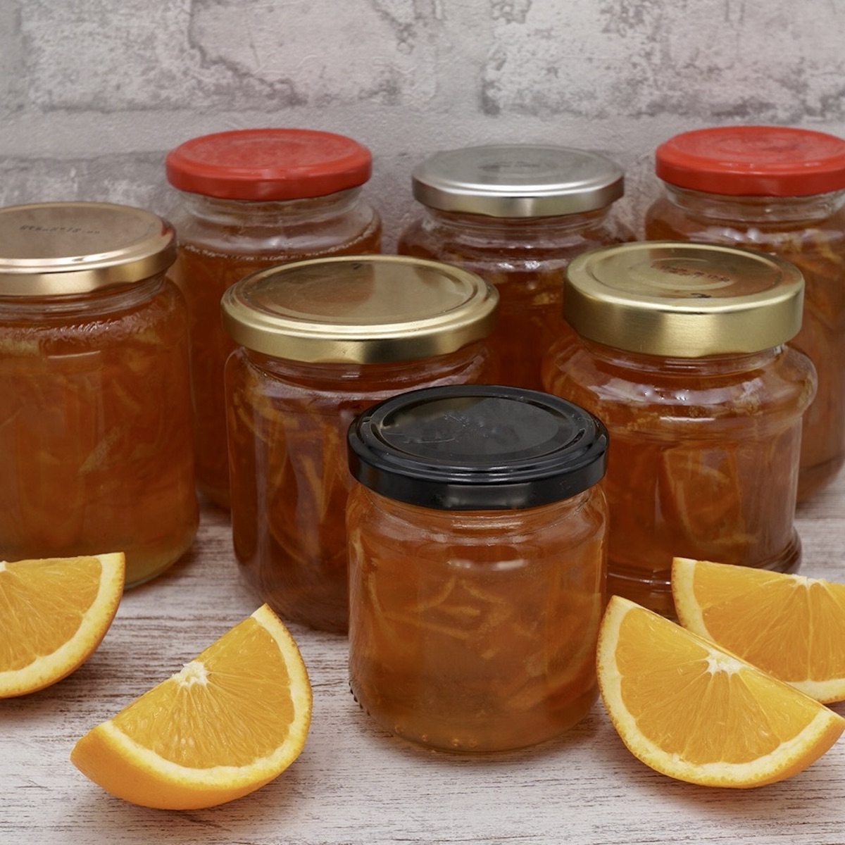 Several jars of homemade Seville orange marmalade.
