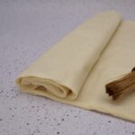 A roll of several sheets of filo pastry.