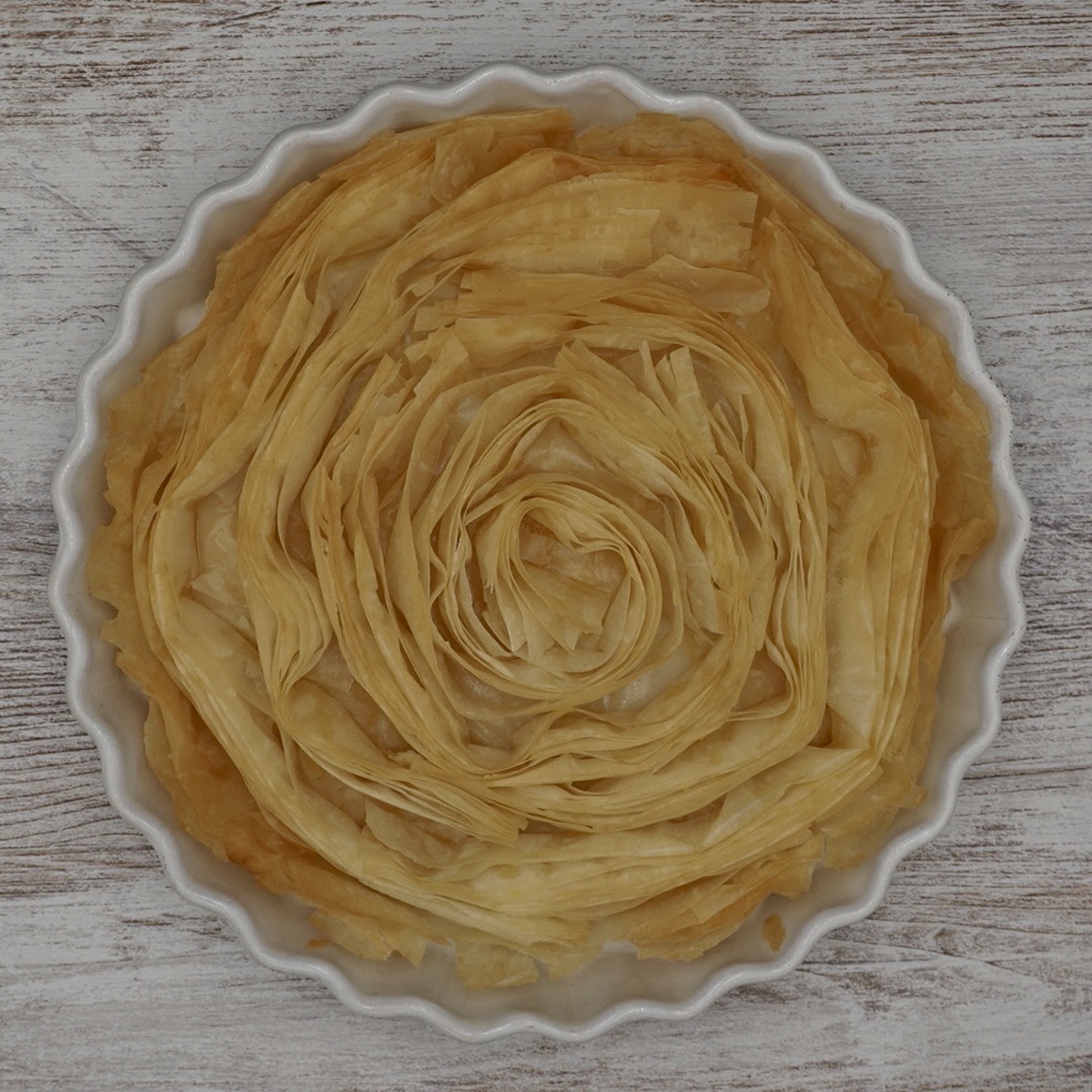 Filo pastry arranged in a circular dish.