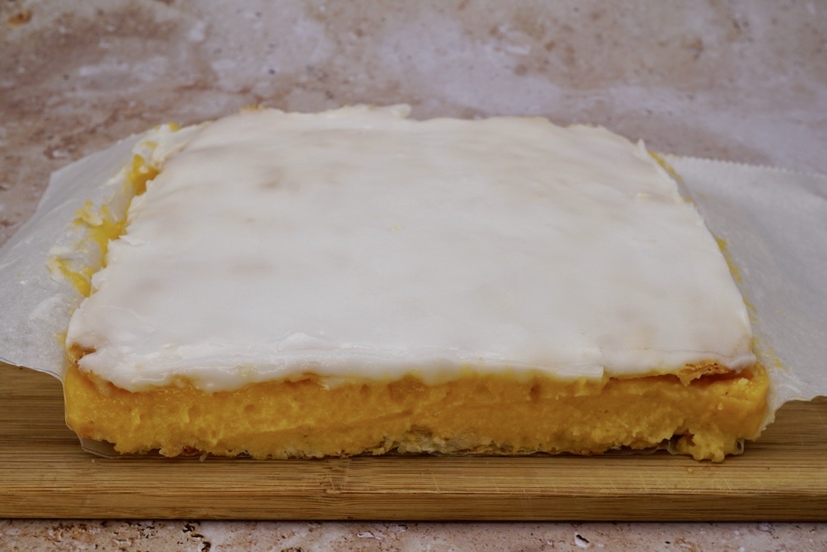 An unsliced slab of vanilla slices. 