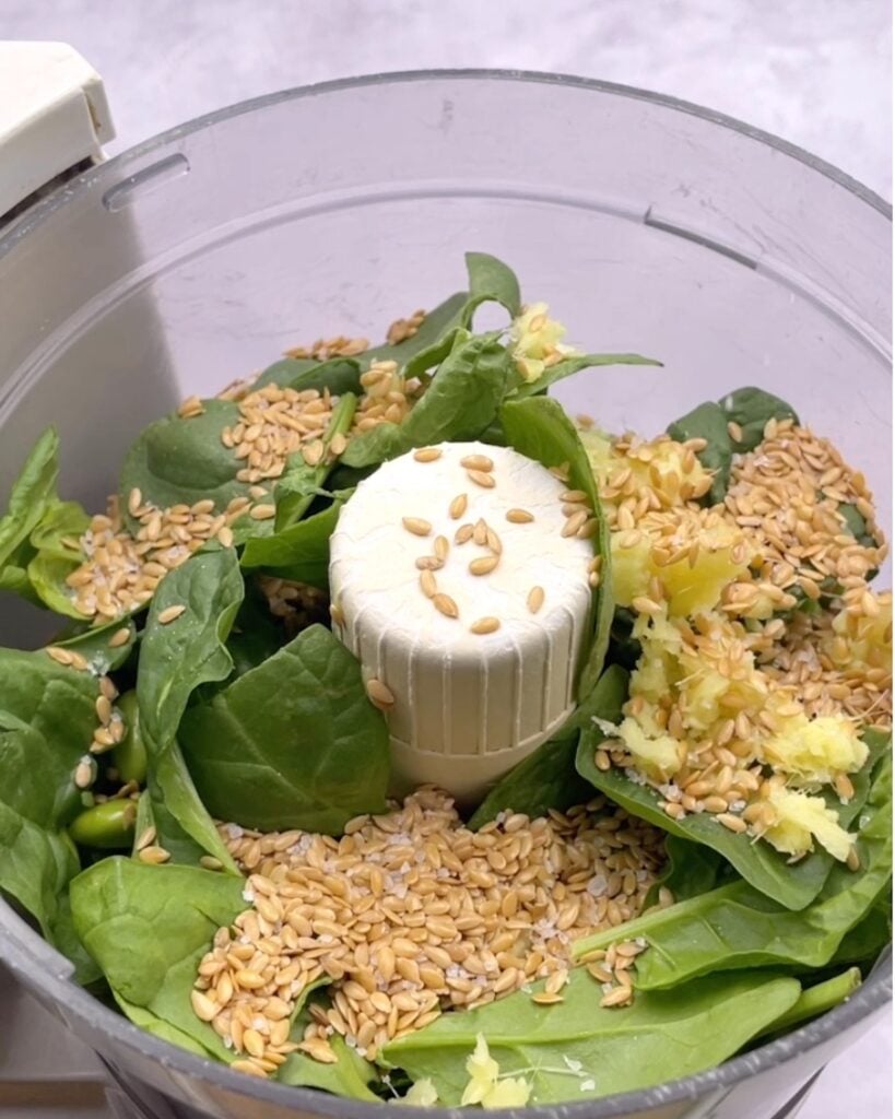 Spinach, seeds and ginger in a food processor.
