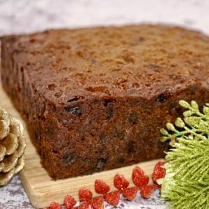 An undecorated traditional English Christmas cake made with dried fruit.