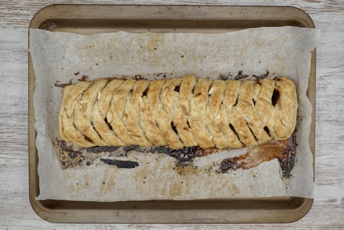 Homemade strudel on a baking tray.