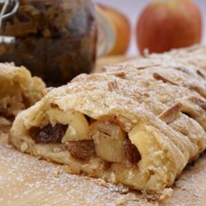 A fruit strudel cut to show the fruit filling.
