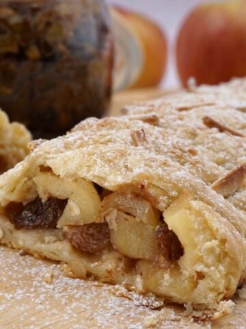 A fruit strudel cut to show the fruit filling.