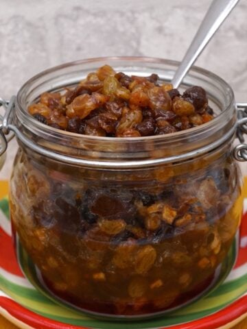 An open jar of homemade Christmas mincemeat.