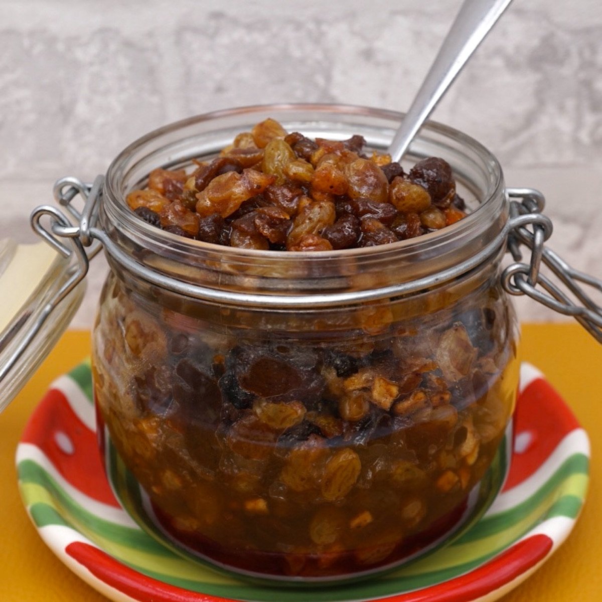 An open jar of homemade Christmas mincemeat.