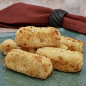 A group of cheesy potato croquettes.