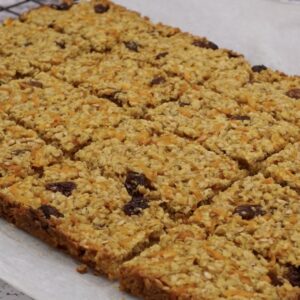 Carrot flapjack cut into portions.