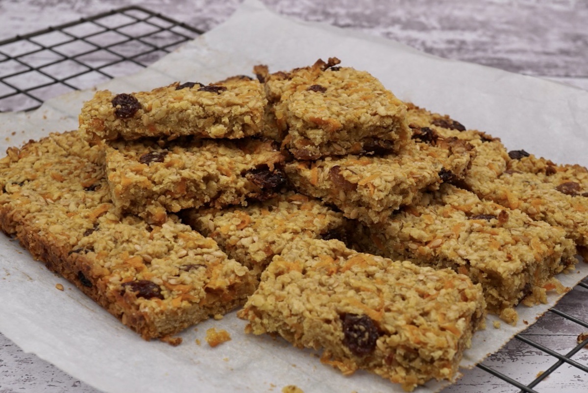 Several portions of carrot flapjacks oat snack bars.