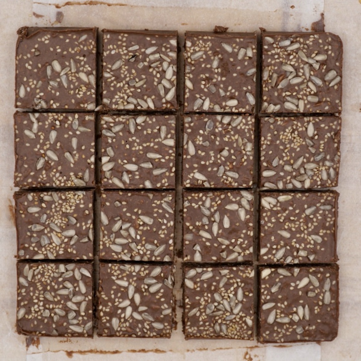 A slab of chocolate tahini cut into sixteen squares.