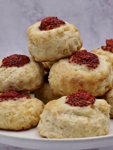 A stack of jam filled scones.