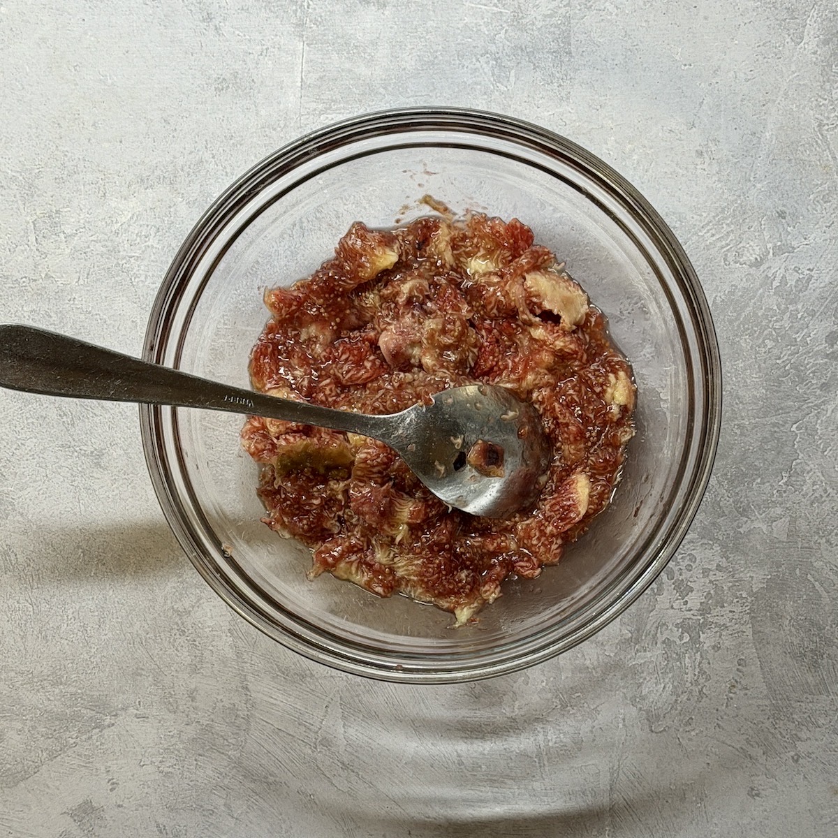 A bowl of mashed fresh figs.